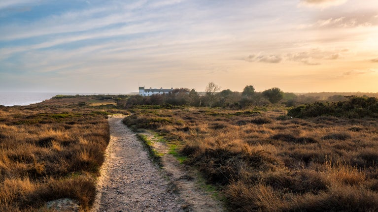The sunsetting over Dunwich Heath looking towards Coastguards Cottages